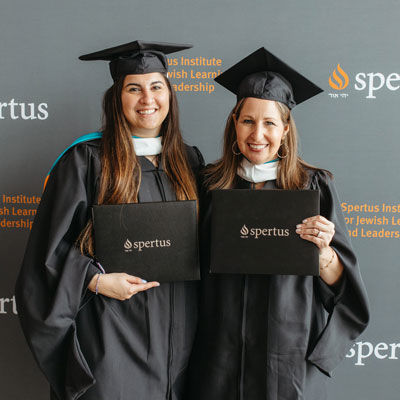 Sarah Jarvis and Rebecca Leavey at Spertus graduation, 2022. Photo by Maggie Russo.
