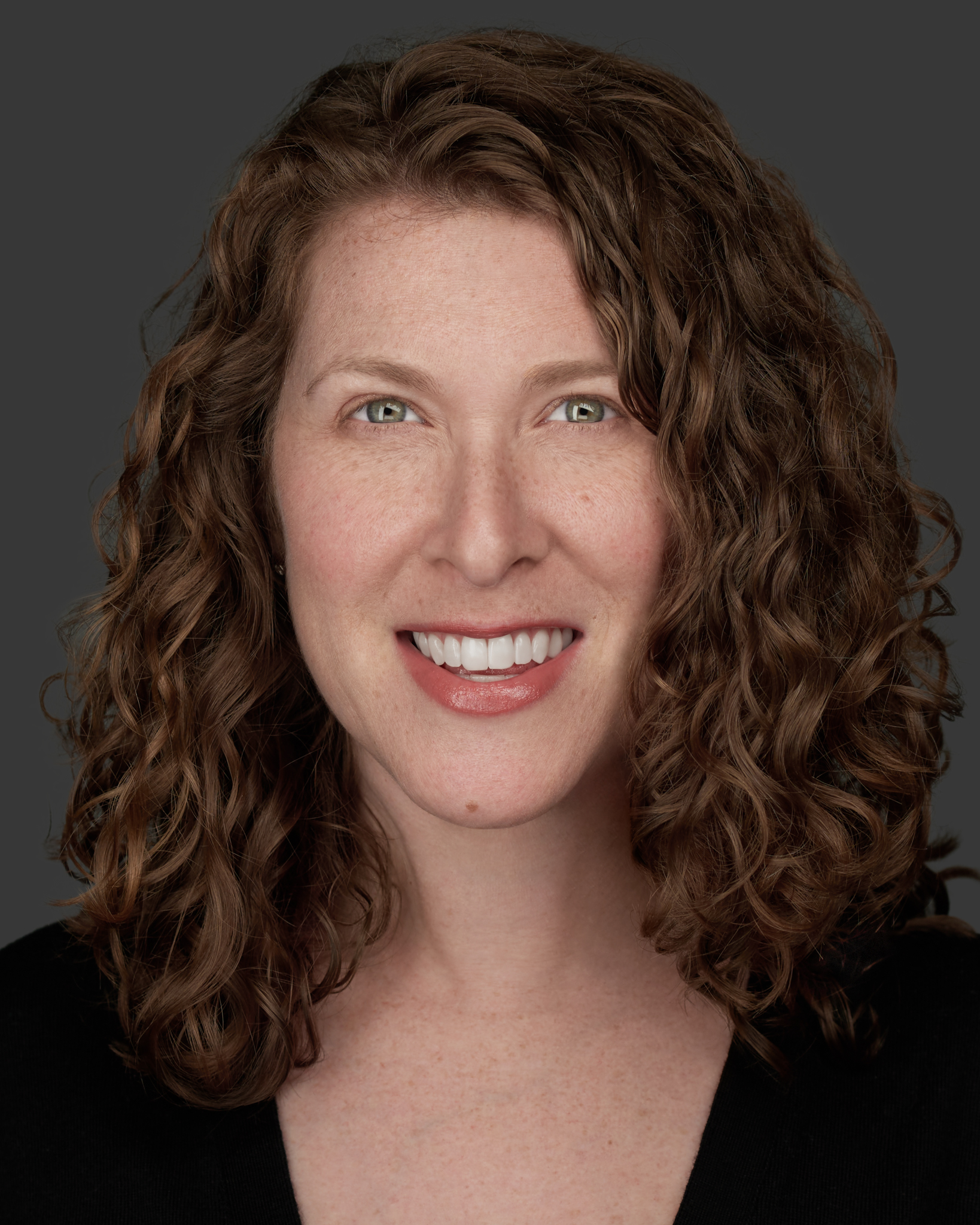 Headshot of Daniella Farah in front of a floral scene