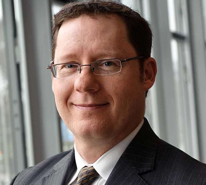Headshot of Daniella Farah in front of a floral scene